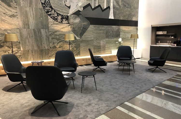 Two groups of Icons of Denmark smile lounge chairs with spire tables in Danske Bank HQ, Stockholm.