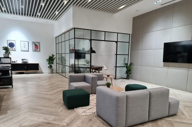 OTDS Project EC1 Sofa with Knock on Wood coffee tables within main reception and looking into boardroom with chairs and table